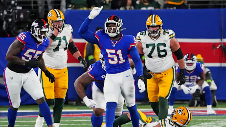 Dec 11, 2023; East Rutherford, New Jersey, USA; New York Giants linebacker Azeez Ojulari (51) celebrates after making a sack on Green Bay Packers quarterback Jordan Love (10) during the fourth quarter at MetLife Stadium.  
