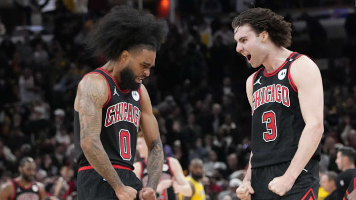 Mar 27, 2025; Chicago, Illinois, USA; Chicago Bulls guard Coby White (0) celebrates his three point basket against the Los Angeles Lakers with guard Josh Giddey (3) during the second half at United Center. Mandatory Credit: David Banks-Imagn Images
