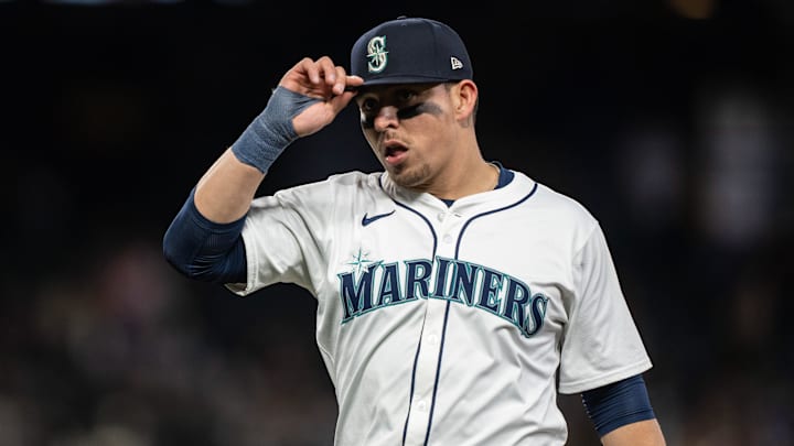 Apr 29, 2024; Seattle, Washington, USA; Seattle Mariners third baseman Luis Urias (16) adjusts his ball cap during a game against the Atlanta Braves at T-Mobile Park. Mandatory Credit: Stephen Brashear-Imagn Images