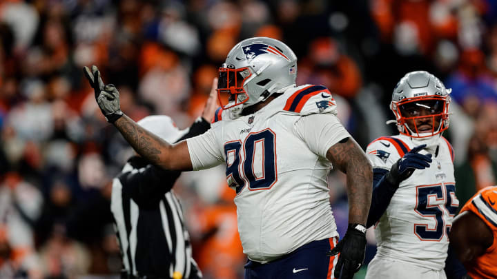 Dec 24, 2023; Denver, Colorado, USA; New England Patriots defensive tackle Christian Barmore (90) reacts after a play ]in the third quarter against the Denver Broncos at Empower Field at Mile High. Mandatory Credit: Isaiah J. Downing-USA TODAY Sports