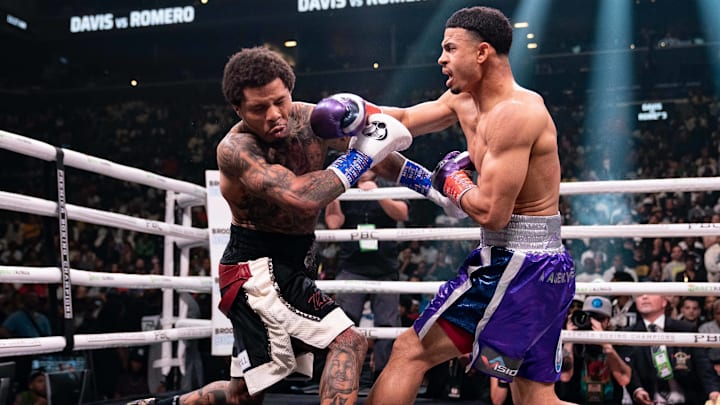 Rolando "Rolly" Romero lands a right hand against Gervonta "Tank" Davis.