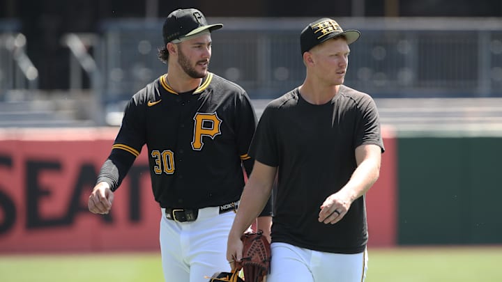 Aug 10, 2025; Pittsburgh, Pennsylvania, USA;  Pittsburgh Pirates pitchers Paul Skenes (30) and Mitch Keller (right) walk in from the bullpen before the game against the Cincinnati Reds at PNC Park. Mandatory Credit: Charles LeClaire-Imagn Images