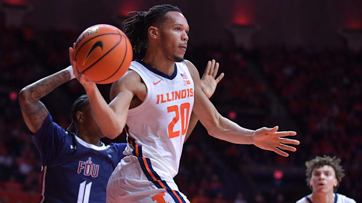 Dec 29, 2023; Champaign, Illinois, USA; Illinois Fighting Illini forward Ty Rodgers (20) drives to