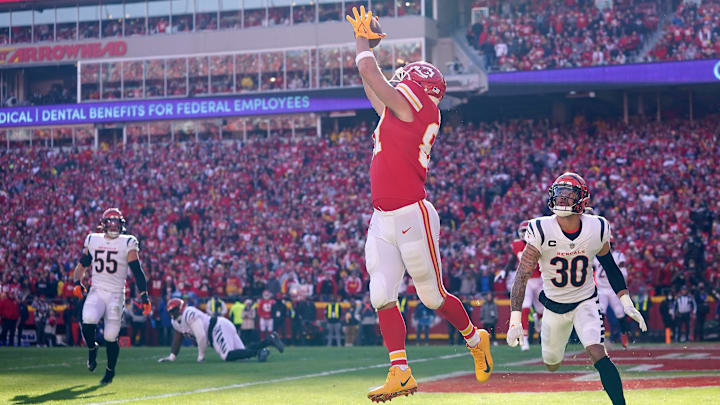 Kansas City Chiefs tight end Travis Kelce (87) catches a touchdown as Cincinnati Bengals free safety Jessie Bates (30) defends in the second quarter during the AFC championship NFL football game on Jan. 30, 2022, at GEHA Field at Arrowhead Stadium in Kansas City.