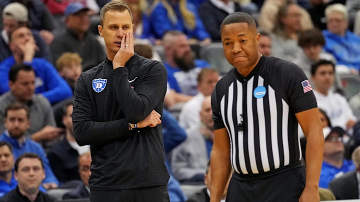 Duke coach Jon Scheyer talks to an official during Duke's 100-93 win over Arizona in the Sweet 16.