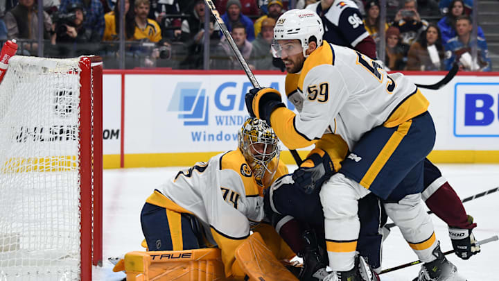 Nov 11, 2024; Denver, Colorado, USA; Nashville Predators goaltender Juuse Saros (74) makes a save in traffic during the second period against the Colorado Avalanche at Ball Arena. Mandatory Credit: Christopher Hanewinckel-Imagn Images