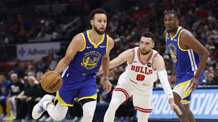Jan 12, 2024; Chicago, Illinois, USA; Golden State Warriors guard Stephen Curry (30) dribbles against Chicago Bulls guard Zach LaVine (8) during the first half at United Center. Mandatory Credit: Kamil Krzaczynski-Imagn Images