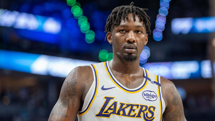 Apr 27, 2025; Minneapolis, Minnesota, USA; Los Angeles Lakers forward Dorian Finney-Smith (17) heads to the sidelines to inbound the ball against the Minnesota Timberwolves in the third quarter during game four of first round for the 2025 NBA Playoffs at Target Center. Mandatory Credit: Matt Blewett-Imagn Images