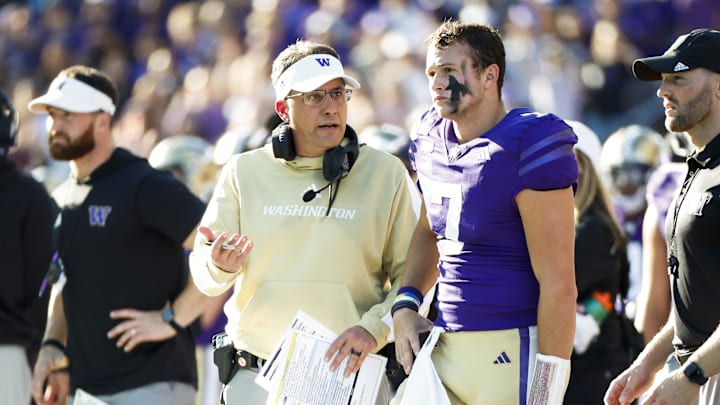 Sep 21, 2024; Seattle, Washington, USA; Washington Huskies head coach Jedd Fisch talks with quarterback Will Rogers (7) during the second quarter against the Northwestern Wildcats at Alaska Airlines Field at Husky Stadium. Mandatory Credit: Joe Nicholson-Imagn Images