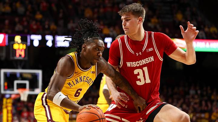 Minnesota Golden Gophers guard Langston Reynolds (6) works around Wisconsin Badgers forward Nolan Winter (31). Minnesota Golden Gophers guard Langston Reynolds (6) works around Wisconsin Badgers forward Nolan Winter (31).