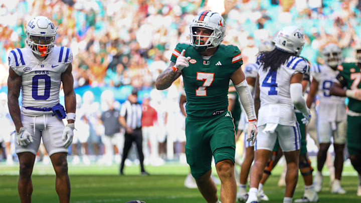 Nov 2, 2024; Miami Gardens, Florida, USA; Miami Hurricanes wide receiver Xavier Restrepo (7) celebrates after scoring a touchdown against the Duke Blue Devils during the third quarter at Hard Rock Stadium. Mandatory Credit: Sam Navarro-Imagn Images