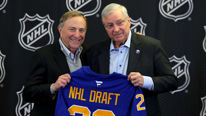 Jan 12, 2026; Buffalo, New York, USA;  NHL Commissioner Gary Bettman and Buffalo Sabres owner Terry Pegula pose for a photo during a press conference announcing the 2026 NHL Draft taking place in Buffalo at KeyBank Center. Mandatory Credit: Timothy T. Ludwig-Imagn Images
