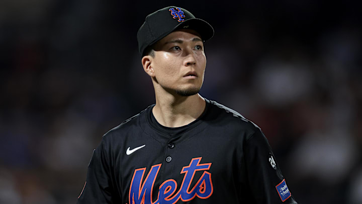 Jul 26, 2024; New York City, New York, USA; New York Mets starting pitcher Kodai Senga (34) looks back at the main scoreboard during the fourth inning against the Atlanta Braves at Citi Field. Mandatory Credit: Vincent Carchietta-Imagn Images