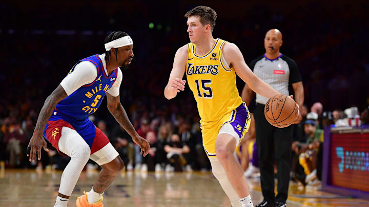 Apr 25, 2024; Los Angeles, California, USA; Los Angeles Lakers guard Austin Reaves (15) moves the ball against Denver Nuggets guard Kentavious Caldwell-Pope (5) during the second half in game three of the first round for the 2024 NBA playoffs at Crypto.com Arena. Mandatory Credit: Gary A. Vasquez-Imagn Images Apr 25, 2024; Los Angeles, California, USA; Los Angeles Lakers guard Austin Reaves (15) moves the ball against Denver Nuggets guard Kentavious Caldwell-Pope (5) during the second half in game three of the first round for the 2024 NBA playoffs at Crypto.com Arena. Mandatory Credit: Gary A. Vasquez-Imagn Images