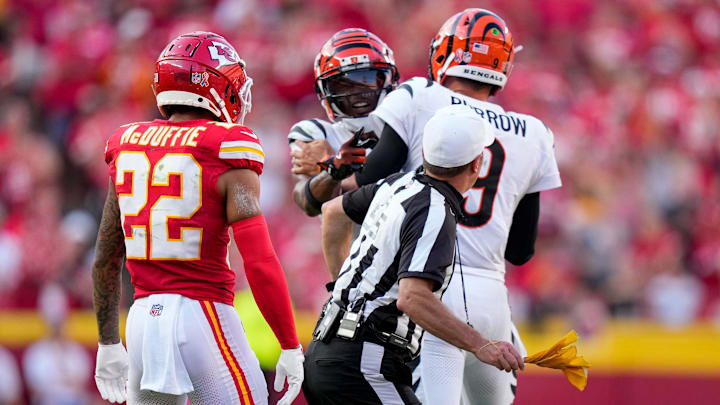 Cincinnati Bengals quarterback Joe Burrow (9) attempts to hold back wide receiver Ja'Marr Chase (1) as he continues to shout at a referee in the fourth quarter of the NFL Week 2 game between the Kansas City Chiefs and the Cincinnati Bengals at Arrowhead Stadium in Kansas City on Sunday, Sept. 15, 2024. The Chiefs took a 26-25 win with a go-ahead field goal as time expired.