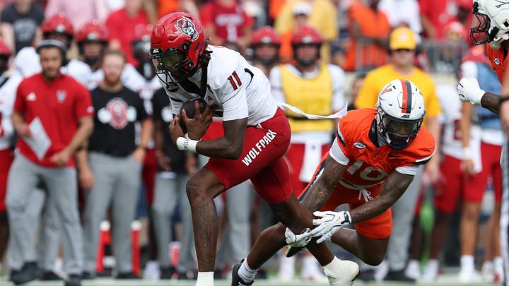 Aug 29, 2026; Charlottesville, Virginia, USA; North Carolina State Wolfpack quarterback CJ Bailey (11) runs with the ball during the second quarter of the game against the Virginia Cavaliers at Scott Stadium. Mandatory Credit: Greg Atkins-Imagn Images Aug 29, 2026; Charlottesville, Virginia, USA; North Carolina State Wolfpack quarterback CJ Bailey (11) runs with the ball during the second quarter of the game against the Virginia Cavaliers at Scott Stadium. Mandatory Credit: Greg Atkins-Imagn Images