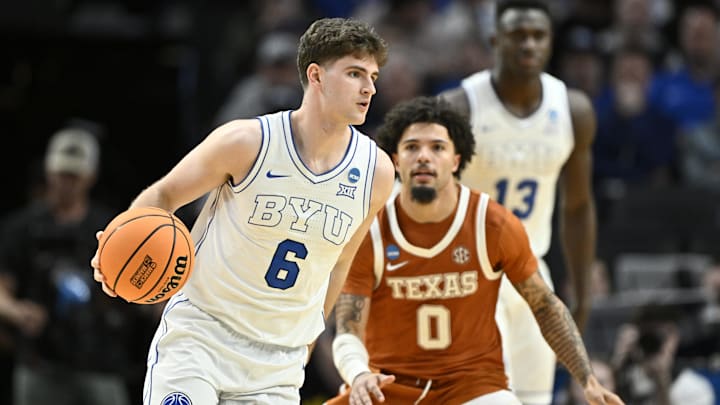 Mar 19, 2026; Portland, OR, USA; BYU Cougars guard Aleksej Kostic (6) dribbles against Texas Longhorns guard Jordan Pope (0) in the second half during a first round game of the men's 2026 NCAA Tournament at Moda Center. Mandatory Credit: Craig Strobeck-Imagn Images