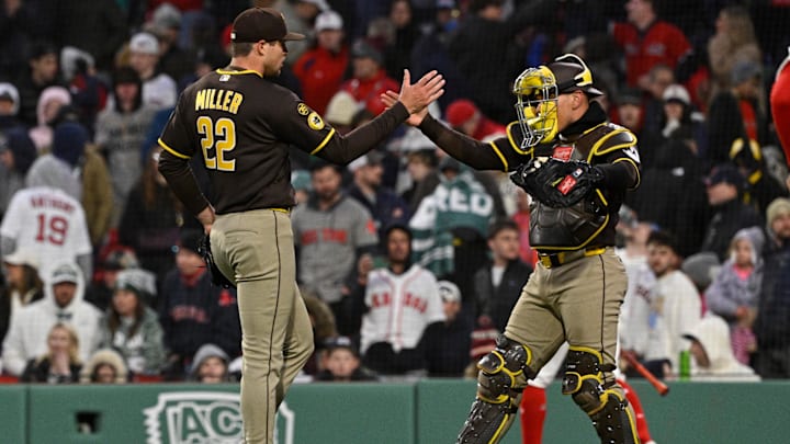 Apr 4, 2026; Foxborough, Massachusetts, USA; San Diego Padres relief pitcher Mason Miller (22) and catcher Freddy Fermin (54) celebrate defeating the Boston Red Sox at Fenway Park. Mandatory Credit: Eric Canha-Imagn Images