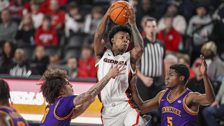Nov 29, 2025; Athens, Georgia, USA; Georgia Bulldogs guard Marcus Millender (4) looks to pass over Tennessee Tech Golden Eagles guard Ja'Quavian Florence (5) during the second half at Stegeman Coliseum. Mandatory Credit: Dale Zanine-Imagn Images Nov 29, 2025; Athens, Georgia, USA; Georgia Bulldogs guard Marcus Millender (4) looks to pass over Tennessee Tech Golden Eagles guard Ja'Quavian Florence (5) during the second half at Stegeman Coliseum. Mandatory Credit: Dale Zanine-Imagn Images