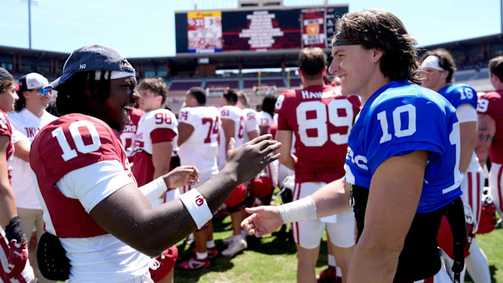 Oklahoma's Kip Lewis and John Mateer greet following during the University of Oklahoma Sooners Spring Game at the Gaylord Family - Oklahoma Memorial Stadium in Norman, Okla., Saturday April 18, 2026.