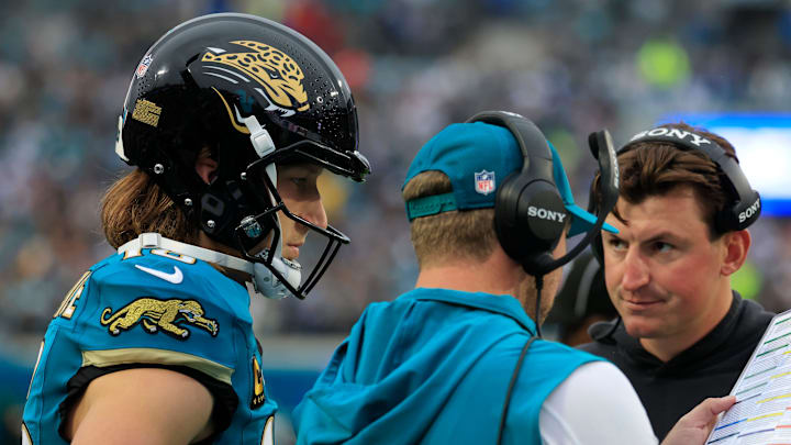 Jacksonville Jaguars quarterback Trevor Lawrence (16) looks on as head coach Liam Coen talks a play with offensive coordinator Grant Udinski looking on during the first quarter of an NFL football game at EverBank Stadium, Sunday, Dec. 7, 2025, in Jacksonville, Fla. The Jaguars defeated the Colts 36-19. Jacksonville Jaguars quarterback Trevor Lawrence (16) looks on as head coach Liam Coen talks a play with offensive coordinator Grant Udinski looking on during the first quarter of an NFL football game at EverBank Stadium, Sunday, Dec. 7, 2025, in Jacksonville, Fla. The Jaguars defeated the Colts 36-19.