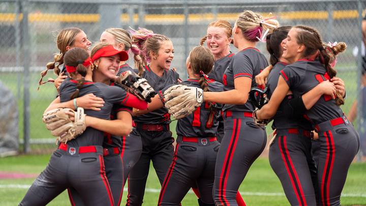 ADM players cheer as they defeat DCG during the 2025 Iowa high school state softball tournament at Harlan Rogers Sports Complex on July 21, 2025, in Fort Dodge. ADM players cheer as they defeat DCG during the 2025 Iowa high school state softball tournament at Harlan Rogers Sports Complex on July 21, 2025, in Fort Dodge.