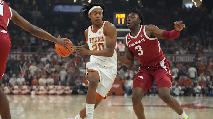 Feb 5, 2025; Austin, Texas, USA; Texas Longhorns guard Tre Johnson (20) drives to the basket while defended by Arkansas Razorbacks forward Adou Thiero (3) during the first half at Moody Center. Mandatory Credit: Scott Wachter-Imagn Images