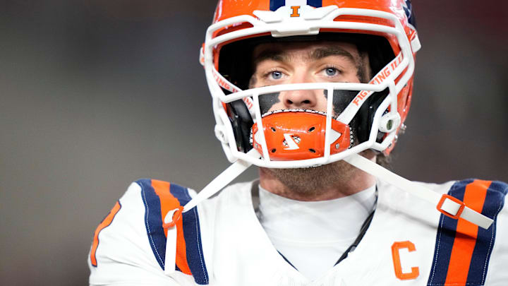 Nov 22, 2025; Madison, Wisconsin, USA; Illinois Fighting Illini quarterback Luke Altmyer (9) warms up before a game against the Wisconsin Badgers at Camp Randall Stadium. Mandatory Credit: Kayla Wolf-Imagn Images