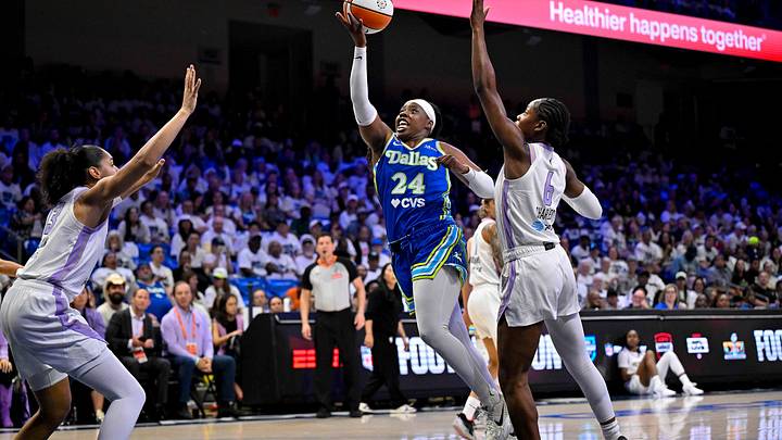 Dallas Wings guard Arike Ogunbowale (24) drives to the basket past Golden State Valkyries guard Kaila Charles (6). Dallas Wings guard Arike Ogunbowale (24) drives to the basket past Golden State Valkyries guard Kaila Charles (6).