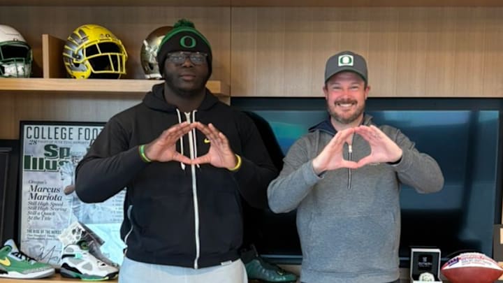 Five-star offensive tackle Immanuel Iheanacho with Oregon Ducks coach Dan Lanning