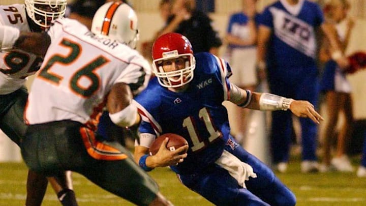 Louisiana Tech quarterback Luke McCown slips trying to get past Miami defender Sean Taylor during a 2003 matchup at Shreveport's Independence Stadium.
SHR 1225 MAINArt Louisiana Tech quarterback Luke McCown slips trying to get past Miami defender Sean Taylor during a 2003 matchup at Shreveport's Independence Stadium.
SHR 1225 MAINArt