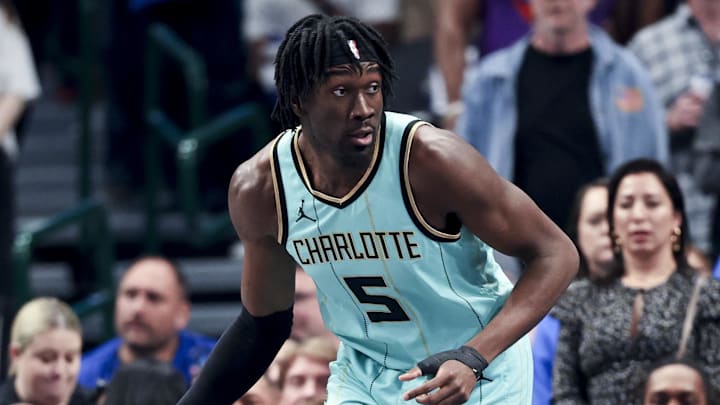 Feb 27, 2025; Dallas, Texas, USA;  Charlotte Hornets center Mark Williams (5) controls the ball during the first half against the Dallas Mavericks at American Airlines Center. Mandatory Credit: Kevin Jairaj-Imagn Images