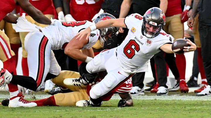 Oct 12, 2025; Tampa, Florida, USA; Tampa Bay Buccaneers quarterback Baker Mayfield (6) dives for a first down during the third quarter against the San Francisco 49ers at Raymond James Stadium. Mandatory Credit: Jonathan Dyer-Imagn Images Oct 12, 2025; Tampa, Florida, USA; Tampa Bay Buccaneers quarterback Baker Mayfield (6) dives for a first down during the third quarter against the San Francisco 49ers at Raymond James Stadium. Mandatory Credit: Jonathan Dyer-Imagn Images