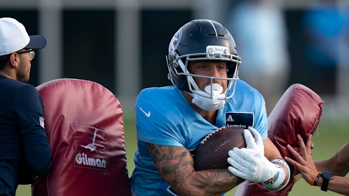 Tennessee Titans wide receiver Xavier Restrepo (87) punches through the pads during training camp at Ascension Saint Thomas Sports Park in Nashville, Tenn., Wednesday, July 30, 2025. Tennessee Titans wide receiver Xavier Restrepo (87) punches through the pads during training camp at Ascension Saint Thomas Sports Park in Nashville, Tenn., Wednesday, July 30, 2025.
