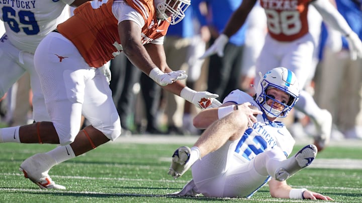 Texas Longhorns defensive lineman Vernon Broughton (45) sacks Kentucky Wildcats quarterback Brock Vandagriff (12) in the first quarter during the first half of an NCAA college football game at Darrell K Royal Texas Memorial Stadium, Austin, Texas, Saturday, Nov 24, 2024.