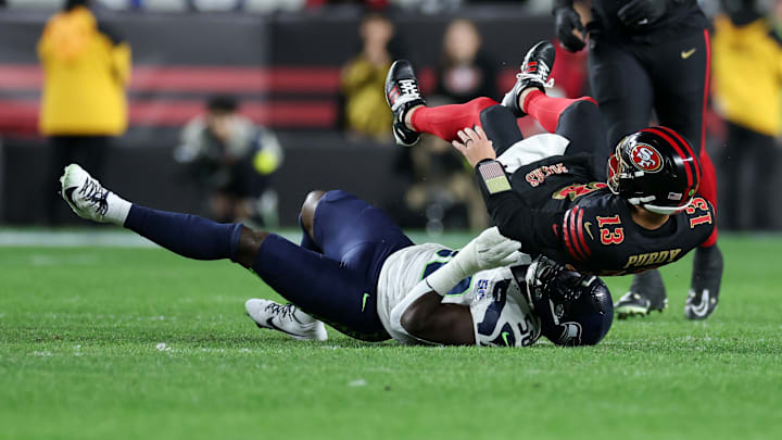 Seattle Seahawks linebacker Derick Hall (58) hits San Francisco 49ers quarterback Brock Purdy (13)