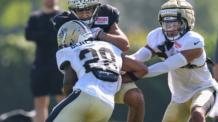 Jul 28, 2025; Metairie, LA, USA; New Orleans Saints wide receiver Mason Tipton (15) is hit on a pass by safety Julian Blackmon (28) at Ochsner Sports Performance Center. Mandatory Credit: Stephen Lew-Imagn Images Jul 28, 2025; Metairie, LA, USA; New Orleans Saints wide receiver Mason Tipton (15) is hit on a pass by safety Julian Blackmon (28) at Ochsner Sports Performance Center. Mandatory Credit: Stephen Lew-Imagn Images