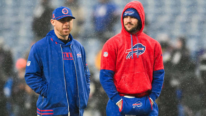 Buffalo Bills QB Josh Allen speaks with offensive coordinator Joe Brady before the game against the Baltimore Ravens.