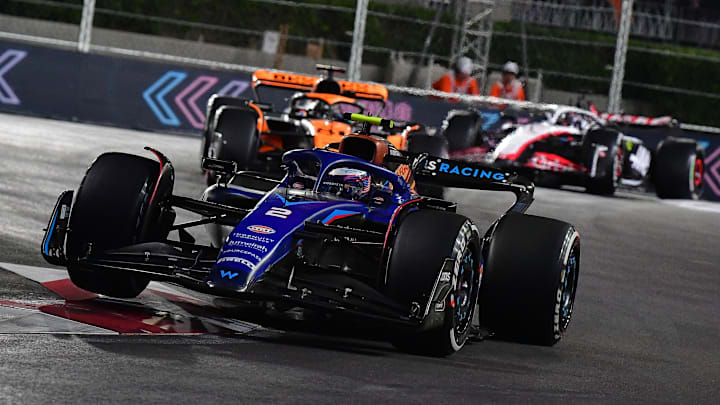 Nov 18, 2023; Las Vegas, Nevada, USA; Williams Racing driver Logan Sargeant of the United States (2) drives ahead of McLaren F1 Team driver Oscar Piastri of Australia (81) during the Las Vegas Grand Prix at Las Vegas Strip Circuit. Mandatory Credit: Gary A. Vasquez-Imagn Images