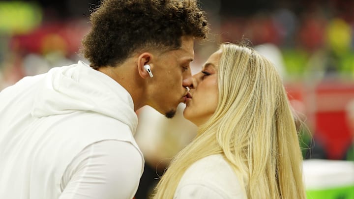 Kansas City Chiefs quarterback Patrick Mahomes (15) kisses his wife Brittany Mahomes before Super Bowl LIX between the Philadelphia Eagles and the Kansas City Chiefs at Caesars Superdome.
