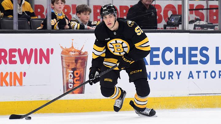 Jan 29, 2026; Boston, Massachusetts, USA; Boston Bruins forward Matt Poitras (51) controls the puck during the third period against the Philadelphia Flyers at TD Garden. Mandatory Credit: Bob DeChiara-Imagn Images
