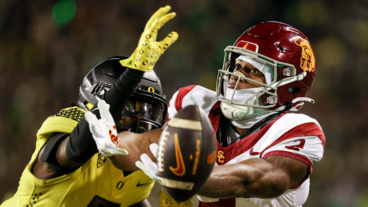 Oregon Ducks defensive back Jahlil Florence (6) blocks a pass intended for USC Trojans wide receiver Brenden Rice (2) during the first half of the game on Saturday, Nov. 11, 2023, at Autzen Stadium in Eugene, Ore.