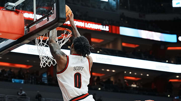 Louisville's James Scott (0) dunks against Morehead State at the KFC Yum! Center in Louisville, Ky. on Nov. 4, 2024