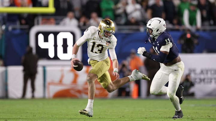 Penn State defensive end Abdul Carter pursues Notre Dame Fighting Irish quarterback Riley Leonard in the second half in the Orange Bowl at Hard Rock Stadium. 