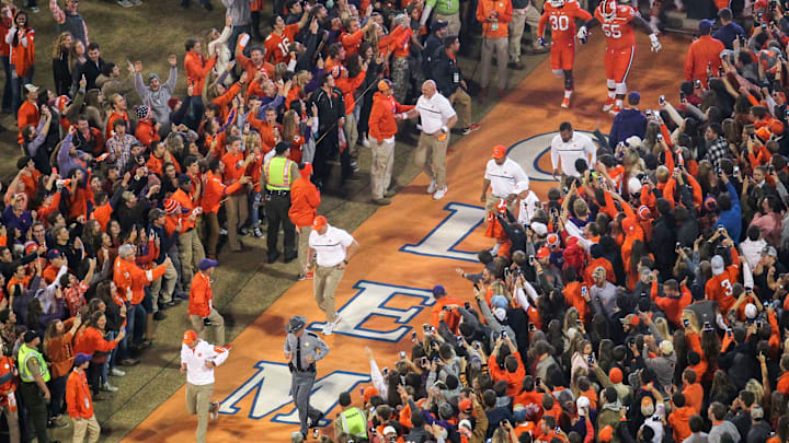 Clemson head coach Dabo Swinney leads coaches and players running down the hill before kickoff with South Carolina on Saturday at Memorial Stadium in Clemson.