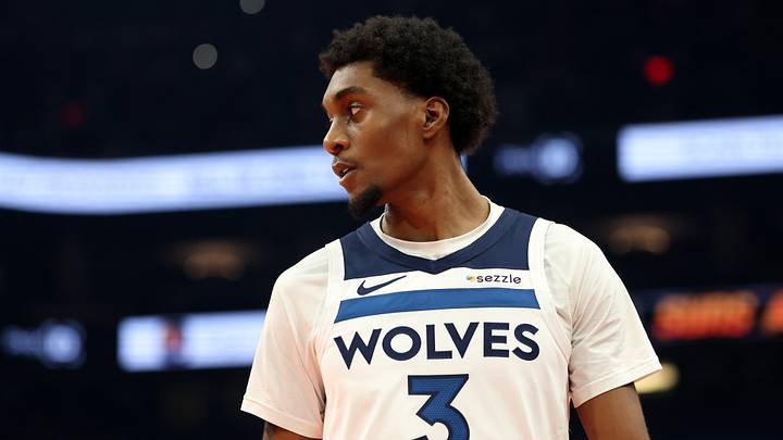 Nov 21, 2025; Phoenix, Arizona, USA; Minnesota Timberwolves forward Jaden McDaniels (3) against the Phoenix Suns during an NBA Cup game at Mortgage Matchup Center. Mandatory Credit: Mark J. Rebilas-Imagn Images
