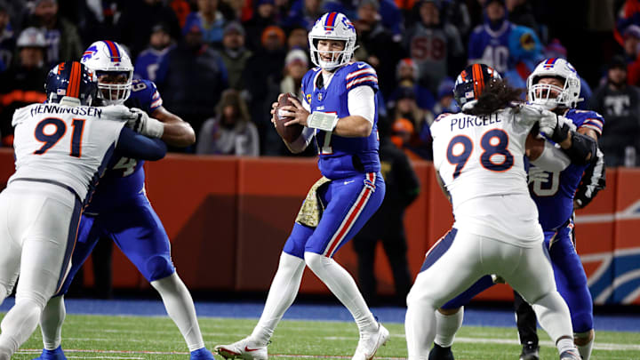Buffalo Bills quarterback Josh Allen (17) looks downfield from the pocket against the Broncos.