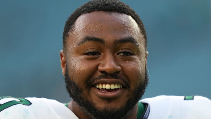 Dec 19, 2021; Miami Gardens, Florida, USA; New York Jets offensive tackle Chuma Edoga (70) leaves the field after the game against the Miami Dolphins at Hard Rock Stadium. Mandatory Credit: Jasen Vinlove-Imagn Images Dec 19, 2021; Miami Gardens, Florida, USA; New York Jets offensive tackle Chuma Edoga (70) leaves the field after the game against the Miami Dolphins at Hard Rock Stadium. Mandatory Credit: Jasen Vinlove-Imagn Images