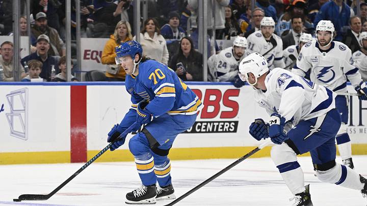 Jan 16, 2026; St. Louis, Missouri, USA; St. Louis Blues center Oskar Sundqvist (70) skates against Tampa Bay Lightning defenseman Darren Raddysh (43) during the second period at Enterprise Center. Mandatory Credit: Jeff Le-Imagn Images Jan 16, 2026; St. Louis, Missouri, USA; St. Louis Blues center Oskar Sundqvist (70) skates against Tampa Bay Lightning defenseman Darren Raddysh (43) during the second period at Enterprise Center. Mandatory Credit: Jeff Le-Imagn Images