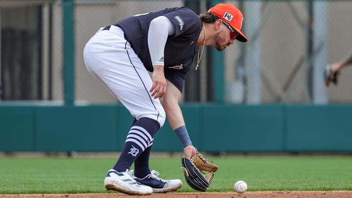 Feb 22, 2025; Lakeland, Florida, USA; Detroit Tigers second base Zach McKinstry (39) fields a ball during the third inning against the Philadelphia Phillies at Publix Field at Joker Marchant Stadium.